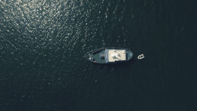 drone shot of a boat in water